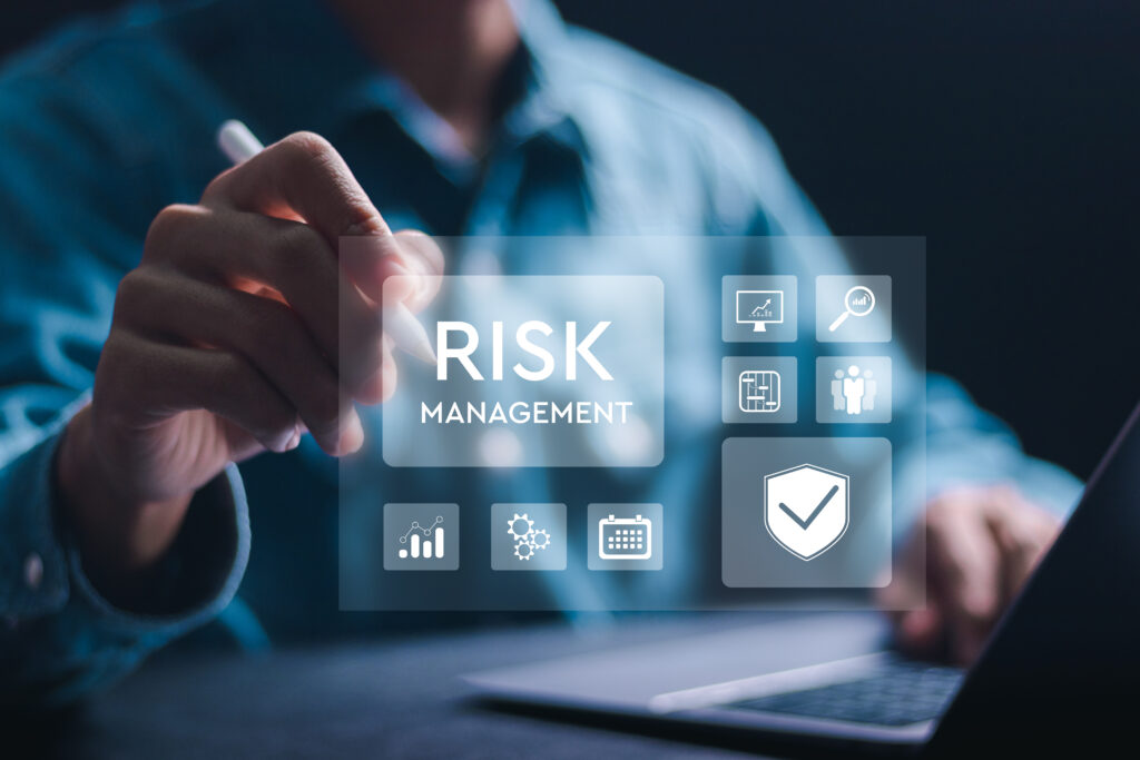 Risk management concept. Businessman use laptop with Risk analysis in business decisions. Risk control and management strategies for risky businesses.